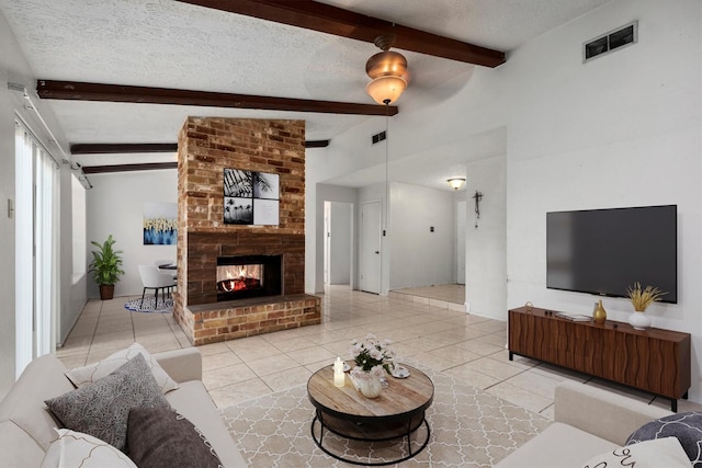 14610 Wind Lock Cir, Houston, TX 77040 - tiled living room featuring a textured ceiling, visible vents, and a fireplace