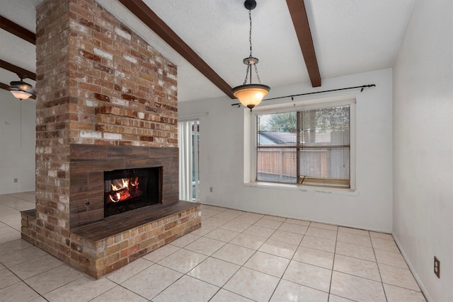 unfurnished living room featuring a textured ceiling, beam ceiling, light tile patterned flooring, and a fireplace