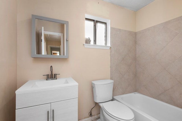 bathroom featuring vanity, toilet, and a bathtub