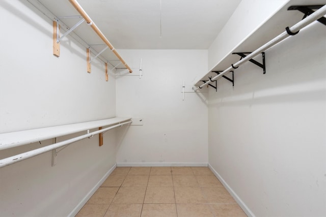 walk in closet featuring light tile patterned floors