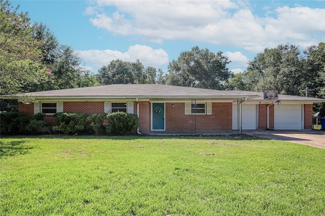 ranch-style home with a garage and a front lawn