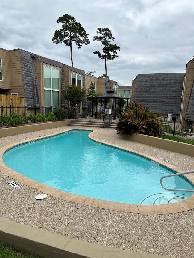 view of swimming pool with a gazebo