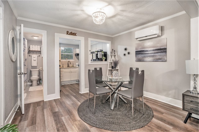 dining space with crown molding, a textured ceiling, sink, dark wood-type flooring, and an AC wall unit