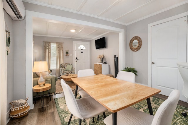 dining room featuring crown molding, dark hardwood / wood-style floors, and a wall mounted air conditioner