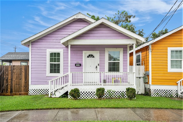 view of front of home with a front lawn and covered porch