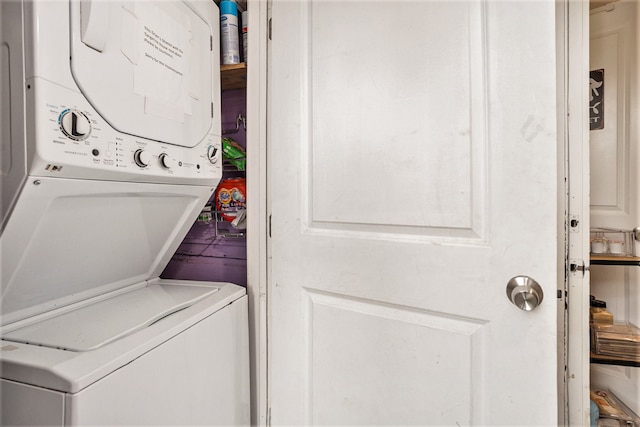 washroom featuring stacked washing maching and dryer