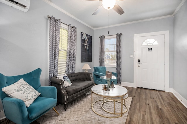 living area with hardwood / wood-style floors, ceiling fan, a wall mounted air conditioner, and ornamental molding