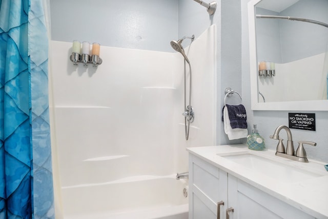 bathroom with shower / tub combo and vanity