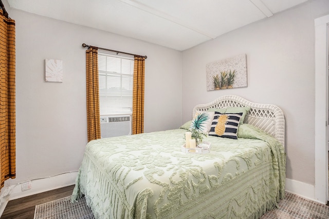 bedroom featuring cooling unit and hardwood / wood-style floors