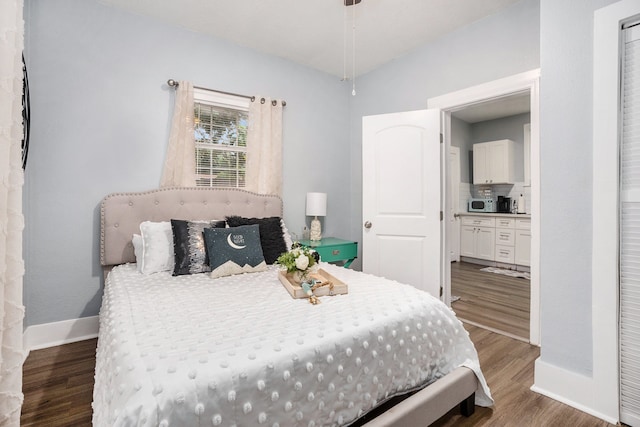 bedroom featuring dark wood-type flooring