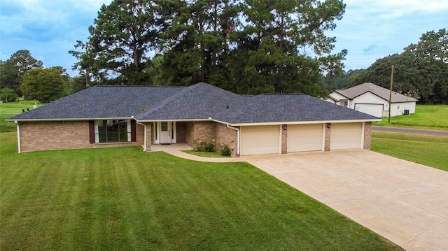 single story home featuring a garage and a front lawn