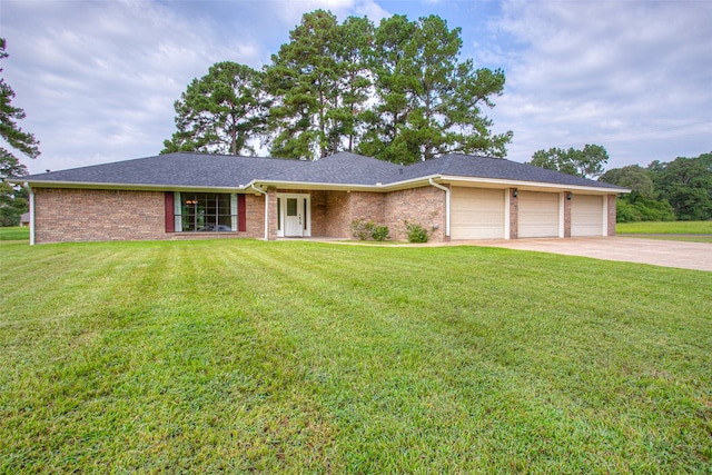 ranch-style home featuring a front yard and a garage