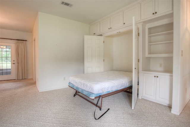 bedroom with light colored carpet