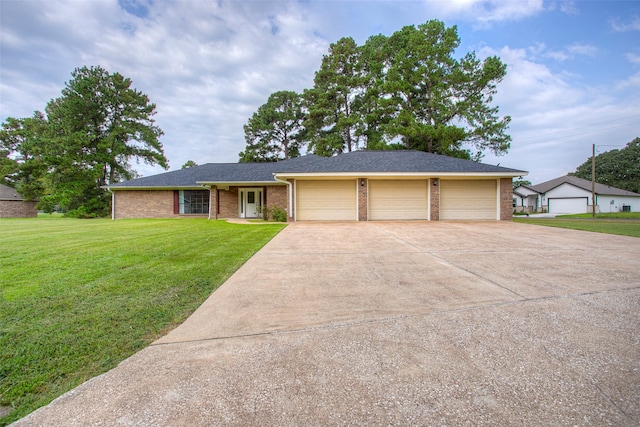 ranch-style house with a garage and a front yard