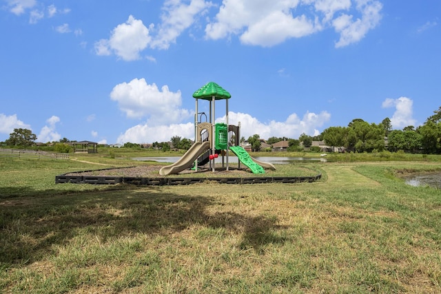 view of jungle gym with a lawn