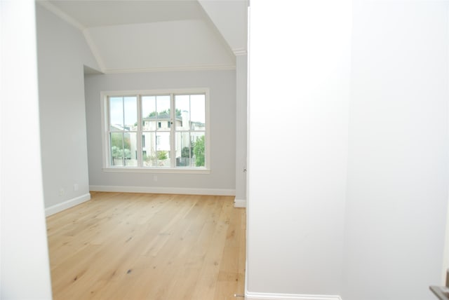 interior space featuring crown molding and light hardwood / wood-style floors