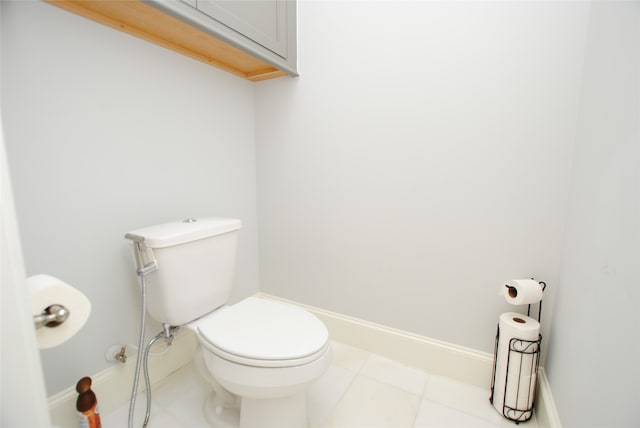 bathroom featuring tile patterned flooring and toilet