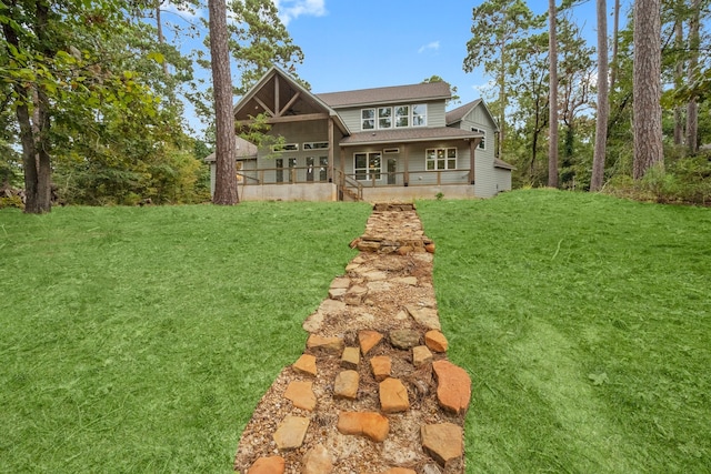 rear view of house with a lawn