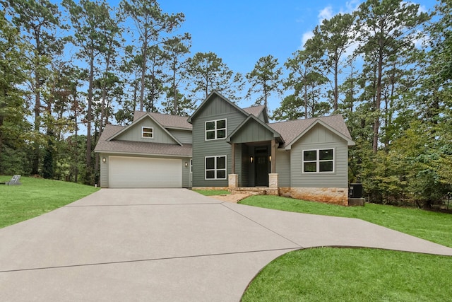 craftsman-style home with a garage and a front lawn