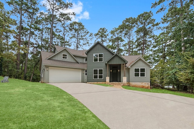 craftsman house featuring a garage and a front lawn