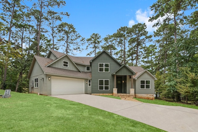 craftsman house featuring a front yard and a garage