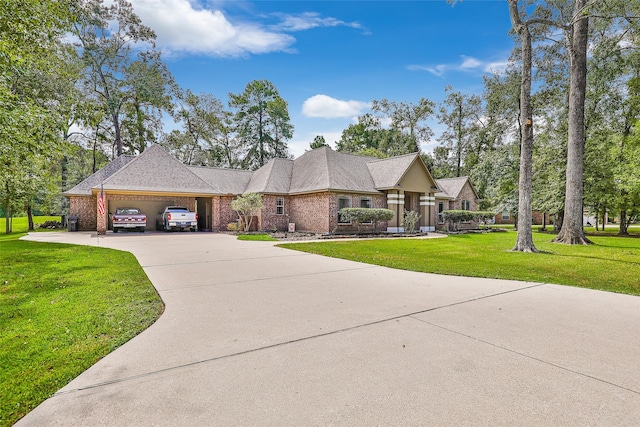 view of front of house with a garage and a front yard