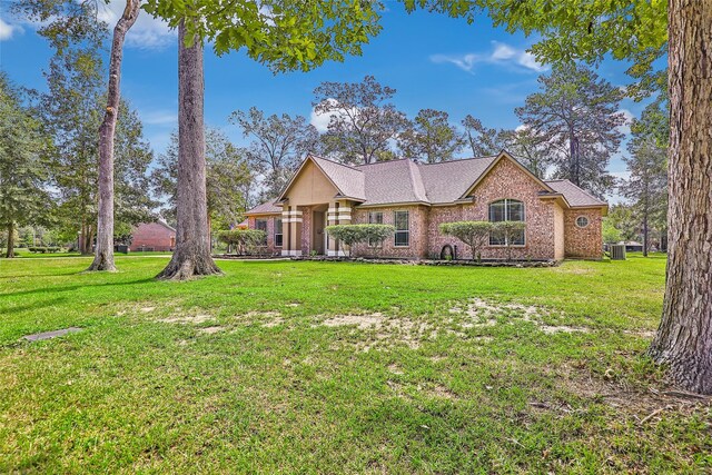 ranch-style home with a front lawn