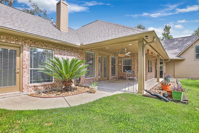 rear view of house featuring a patio area, ceiling fan, and a yard