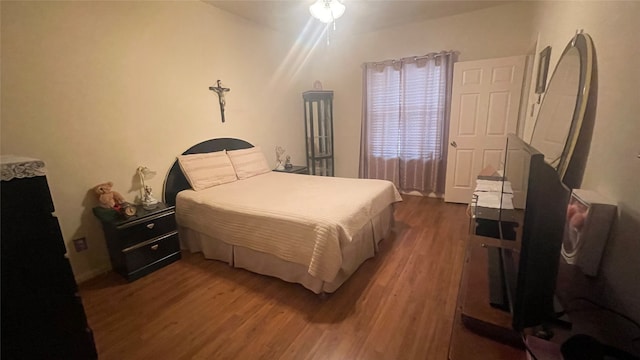 bedroom featuring dark wood-type flooring