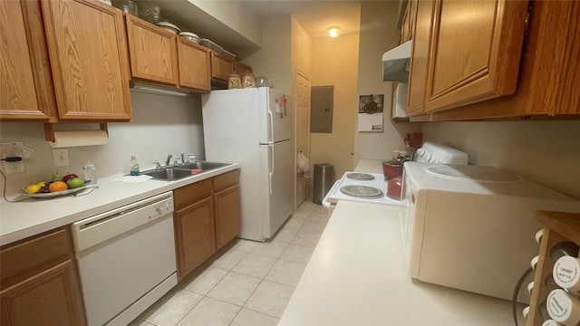 kitchen with light tile patterned floors, white appliances, electric panel, sink, and extractor fan