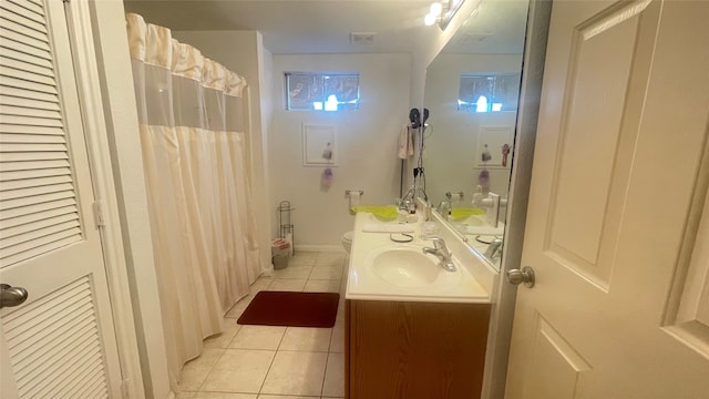 bathroom featuring vanity, toilet, and tile patterned floors