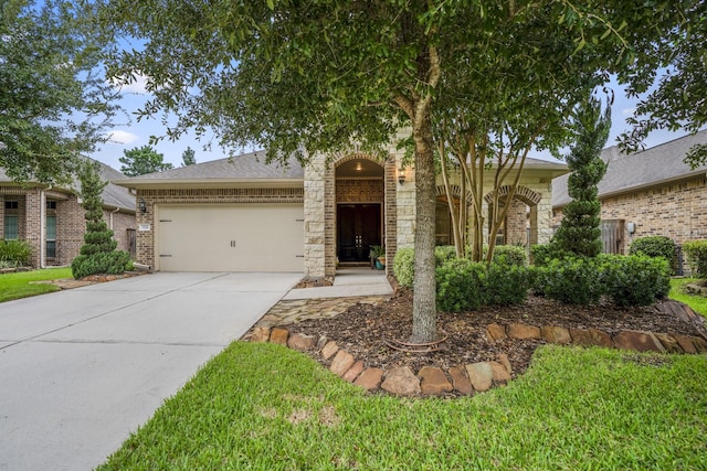 view of front of house with a garage, concrete driveway, brick siding, and a shingled roof