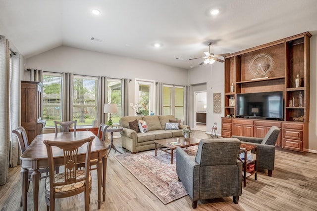 living area with light wood finished floors, visible vents, a ceiling fan, vaulted ceiling, and recessed lighting