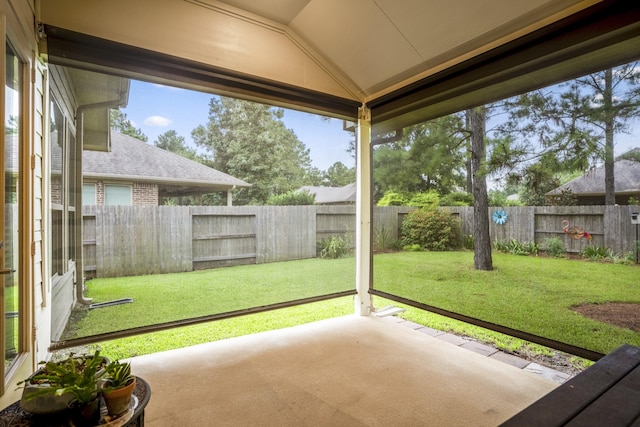 unfurnished sunroom with lofted ceiling