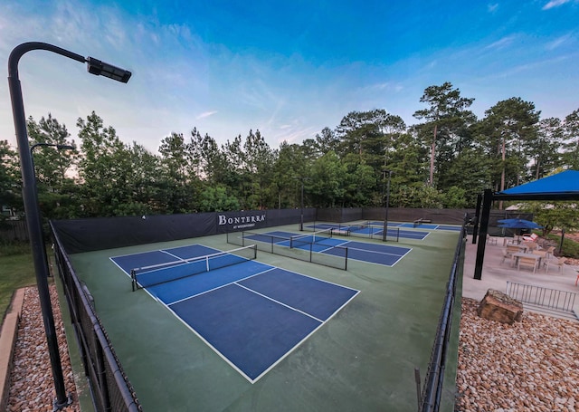 view of tennis court with fence