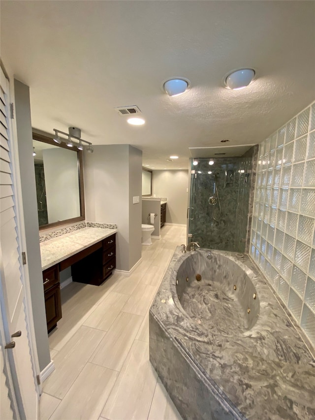 full bathroom with toilet, independent shower and bath, a bidet, vanity, and a textured ceiling