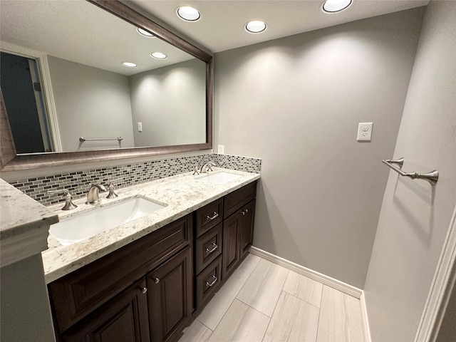 bathroom with vanity and backsplash