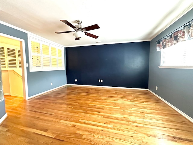 unfurnished room featuring ceiling fan, ornamental molding, and light hardwood / wood-style flooring