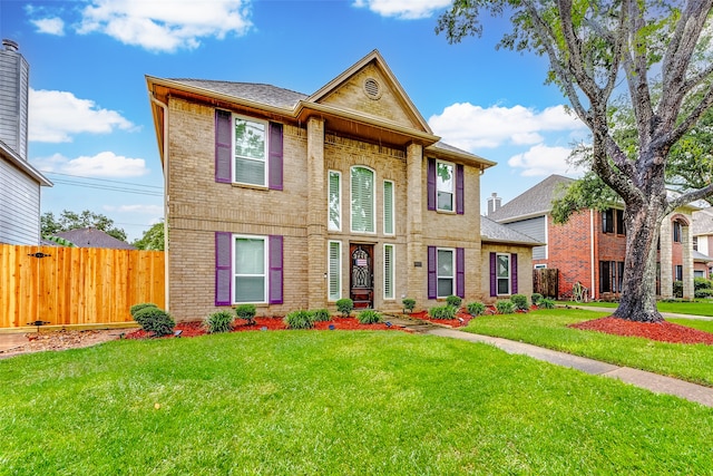 view of front of home with a front lawn