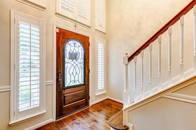 foyer entrance with hardwood / wood-style floors