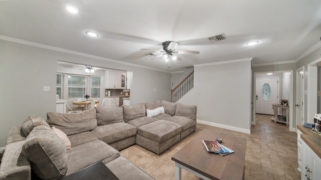 living room featuring ceiling fan and ornamental molding