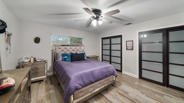 bedroom featuring light hardwood / wood-style flooring and ceiling fan