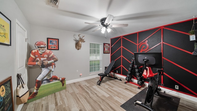 workout room with wood-type flooring and ceiling fan