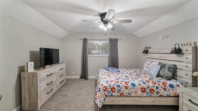 bedroom with light carpet, vaulted ceiling, and ceiling fan