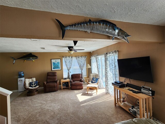 carpeted living room with a textured ceiling and ceiling fan