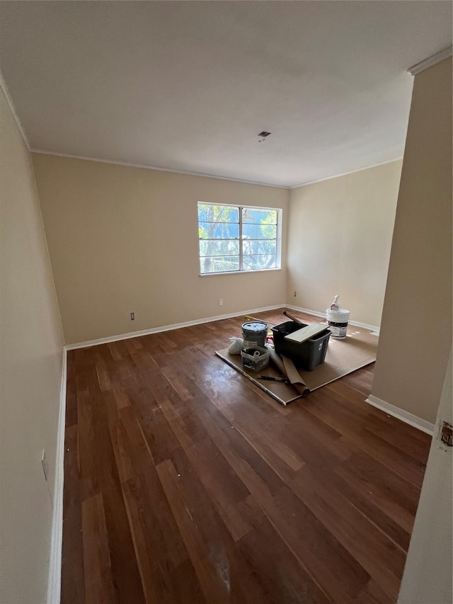 spare room with dark hardwood / wood-style floors