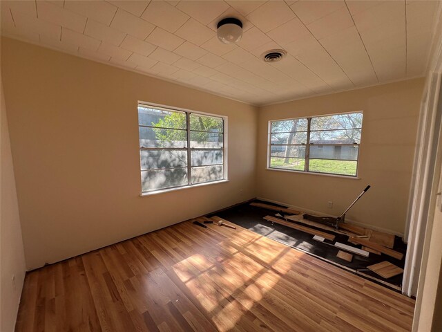 empty room featuring hardwood / wood-style flooring