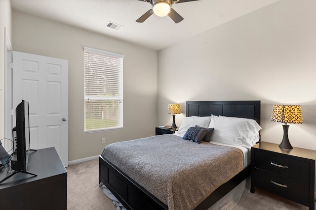 bedroom with light colored carpet and ceiling fan