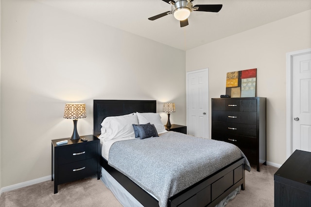 bedroom featuring light colored carpet and ceiling fan