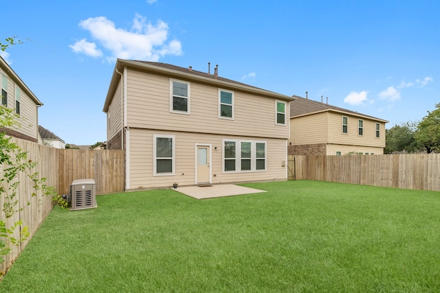 back of house with a patio area and a yard